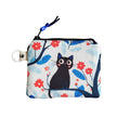 Monedero gato árbol flores rojas