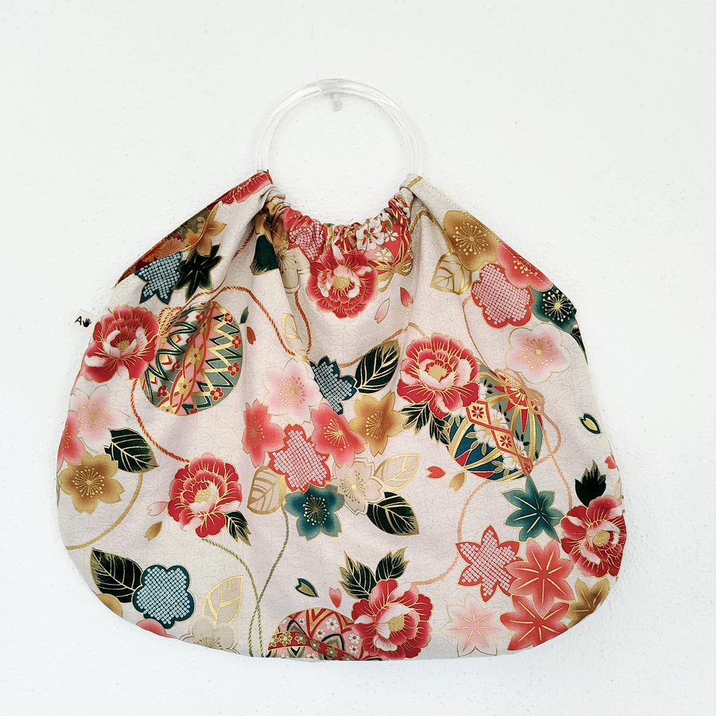 Bolso de aros blanco y dorado