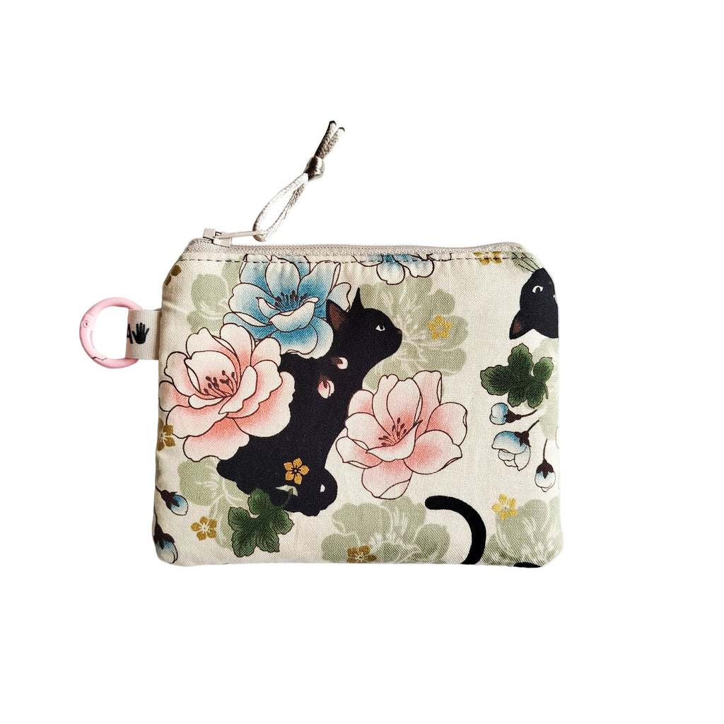 Monedero gato fondo claro flores