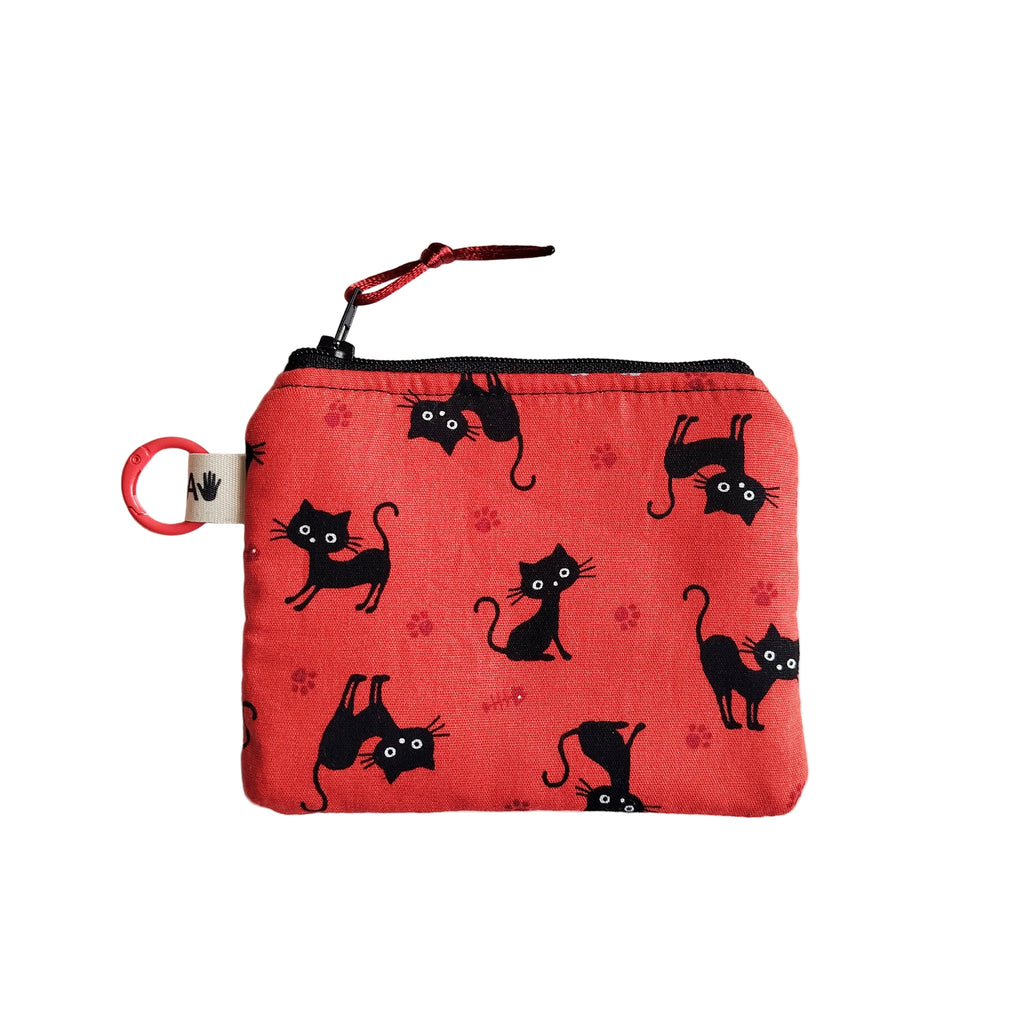 Monedero gatos y huellas coral